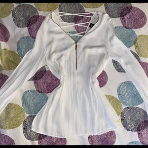 Blouse with front zipper and cross cross detail on back